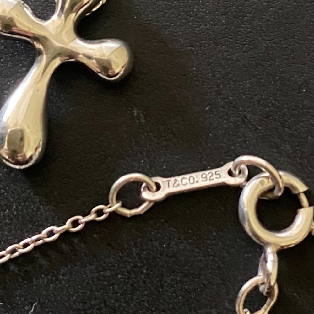 Tiffany’s Cross Necklace:  Elsa Peretti
